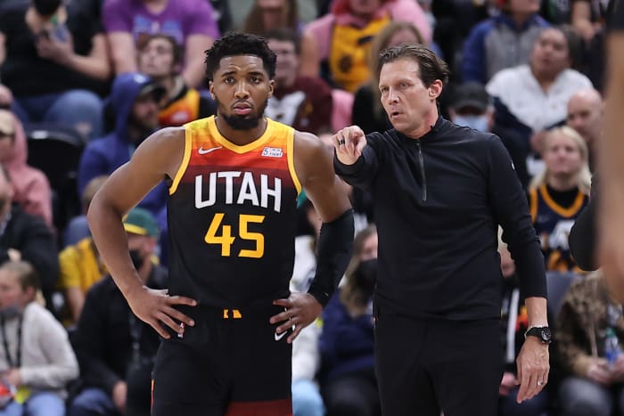 Utah Jazz guard Donovan Mitchell stands next to coach Quin Snyder.